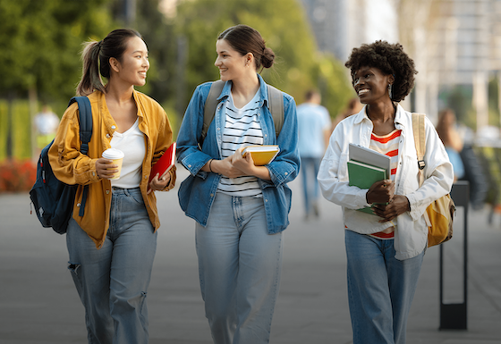 Group of students walking on campus together