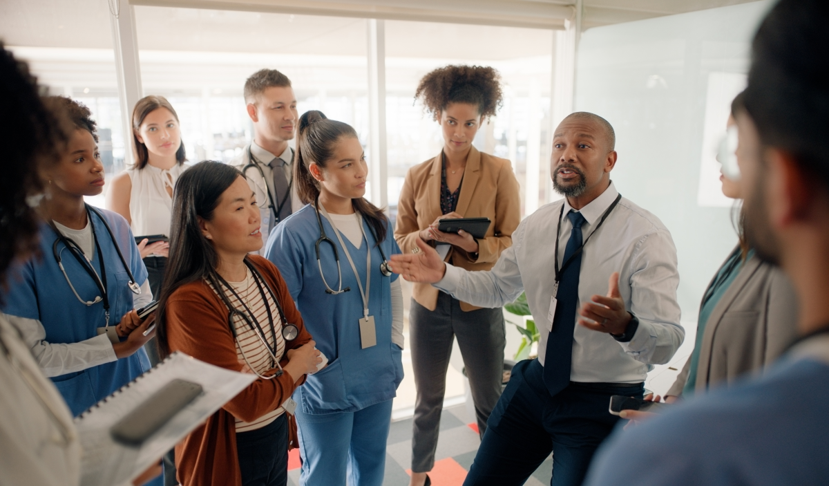 Healthcare employees talking in a meeting